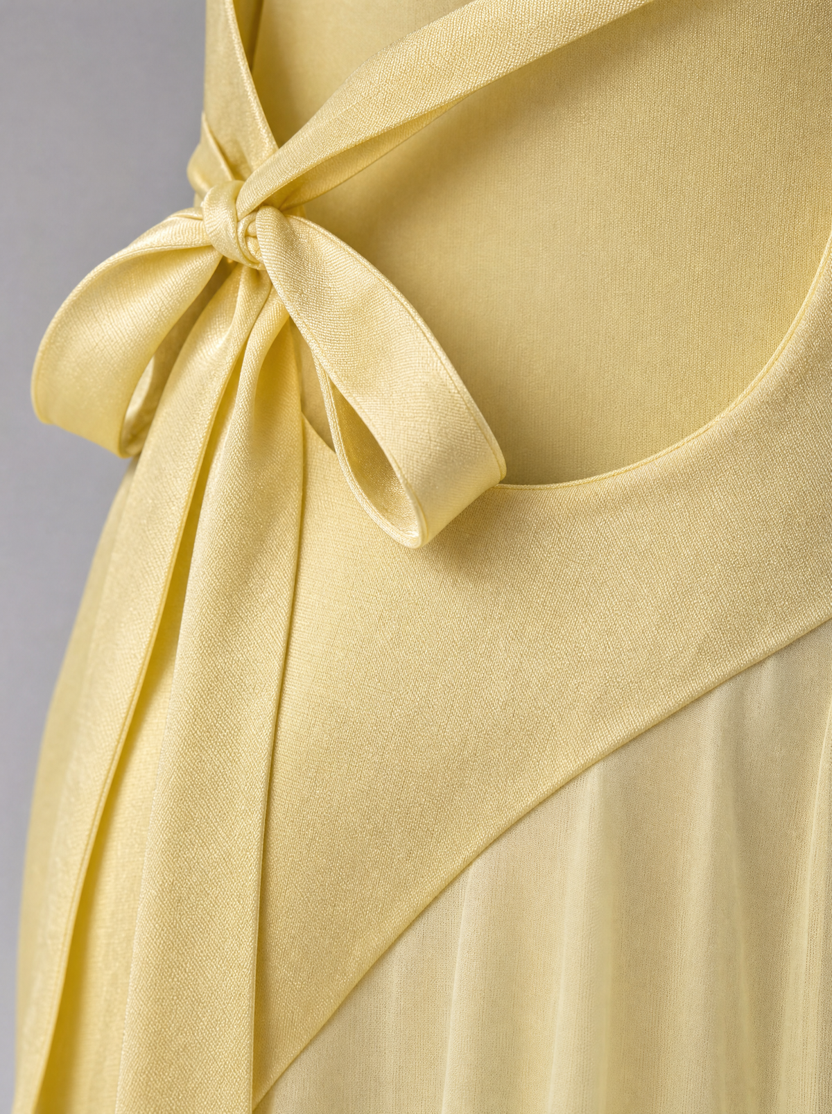Amara gown detail: satin tie across the open back
